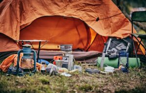 Outdoor enthusiast using survival gear during a wilderness camping trip